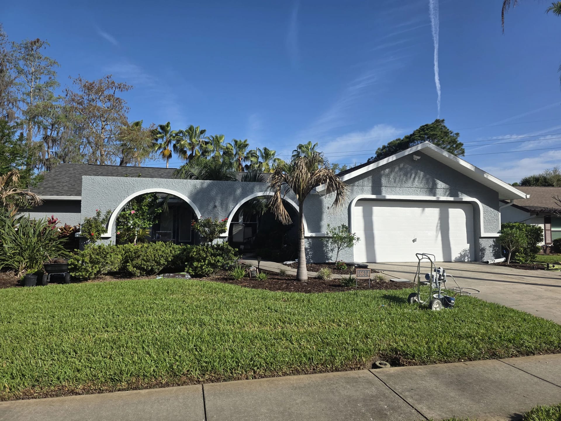 Arched home exterior after a completed painting project