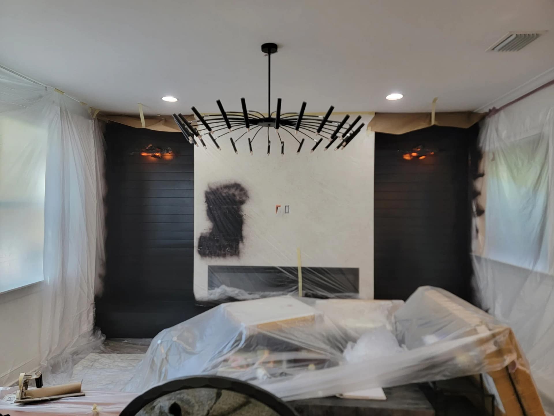 Fireplace accent wall prepared for painting in a home interior